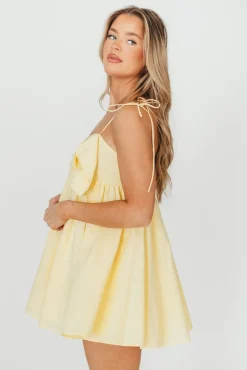 Discount Worth Collective Irelyn Babydoll Mini Dress with Bow Accent in Yellow
